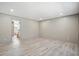 Spacious bedroom showcasing wood-look flooring and neutral tones, creating a serene and relaxing atmosphere at 1360 Burr Hill Rd, Cottageville, SC 29435