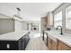 Kitchen featuring stainless steel appliances, an island, a farmhouse sink, and an open layout to living area at 1360 Burr Hill Rd, Cottageville, SC 29435
