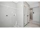 Laundry room equipped with washer hookups, wire shelving, and closet, offering a functional and organized space at 1360 Burr Hill Rd, Cottageville, SC 29435