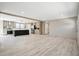 Spacious open-concept living and kitchen area featuring modern light wood floors and ample natural light at 1360 Burr Hill Rd, Cottageville, SC 29435