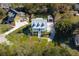 Stunning aerial of blue two-story home featuring a charming front porch and dormer windows at 1367 N Edgewater Dr, Charleston, SC 29407