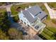 Aerial view of the property highlighting its well-manicured lawn and deck with outdoor seating at 1367 N Edgewater Dr, Charleston, SC 29407