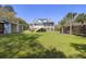 Expansive backyard featuring a well-maintained lawn, deck, and storage shed at 1367 N Edgewater Dr, Charleston, SC 29407