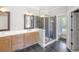 Elegant bathroom with dual sinks, a glass enclosed shower, and natural light at 1367 N Edgewater Dr, Charleston, SC 29407