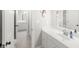 Bright white bathroom featuring a single sink vanity, neutral paint, and a view to the connected bedroom at 1367 N Edgewater Dr, Charleston, SC 29407