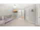 Bright bedroom with neutral carpet and open view to a connected bathroom at 1367 N Edgewater Dr, Charleston, SC 29407
