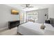 Bedroom featuring a television, large window, light-colored walls, and carpeted floors at 1367 N Edgewater Dr, Charleston, SC 29407