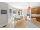 Bright breakfast nook with large windows, stylish lighting and an adjoining kitchen area at 1367 N Edgewater Dr, Charleston, SC 29407