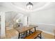 Bright dining room features hardwood floors, stylish lighting and staircase access to other levels of the home at 1367 N Edgewater Dr, Charleston, SC 29407