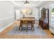 Beautiful dining room is brightly lit with hardwood floors and a view to the outside through large windows at 1367 N Edgewater Dr, Charleston, SC 29407