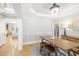 This dining room is brightly lit with hardwood floors, stylish lighting and features an adjoining living space at 1367 N Edgewater Dr, Charleston, SC 29407