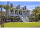 Charming two-story home featuring a welcoming front porch and well-manicured landscaping at 1367 N Edgewater Dr, Charleston, SC 29407