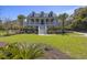 Inviting two-story home with lush landscaping, showcasing curb appeal and a serene setting at 1367 N Edgewater Dr, Charleston, SC 29407