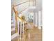Grand foyer with hardwood floors, elegant staircase, and a view into the living room at 1367 N Edgewater Dr, Charleston, SC 29407