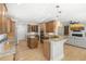 Gourmet kitchen featuring a center island, wood cabinets, granite countertops and stainless appliances at 1367 N Edgewater Dr, Charleston, SC 29407