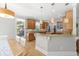 Bright kitchen with wood cabinets, granite countertops, breakfast bar and stainless steel appliances at 1367 N Edgewater Dr, Charleston, SC 29407