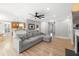 This bright living room features hardwood floors, comfortable seating, access to a dining area and other rooms at 1367 N Edgewater Dr, Charleston, SC 29407