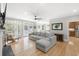 Bright living room features hardwood floors, comfortable seating, access to the outside and adjoins a dining area at 1367 N Edgewater Dr, Charleston, SC 29407