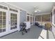 Covered porch features a ceiling fan, recessed lighting, access to the backyard and a beverage center at 1367 N Edgewater Dr, Charleston, SC 29407