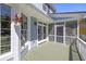 Inviting screened porch with access to the house and views of the beautiful backyard at 1367 N Edgewater Dr, Charleston, SC 29407