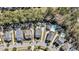 An aerial view of residential neighborhood homes, with swimming pools, landscaping, and tree-lined streets at 1391 Crane Creek Dr, Mount Pleasant, SC 29466
