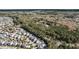Aerial view of a neighborhood nestled amidst lush greenery with various home styles and community features at 1391 Crane Creek Dr, Mount Pleasant, SC 29466