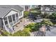 Aerial shot of backyard featuring a screened porch, a hot tub under a pergola, and a well-maintained lawn at 1391 Crane Creek Dr, Mount Pleasant, SC 29466