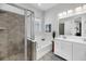 Bathroom with tiled shower, soaking tub, double vanity, and abundant natural light at 1391 Crane Creek Dr, Mount Pleasant, SC 29466