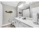 Stylish bathroom with white cabinets, modern lighting, and a large mirror, offering a clean aesthetic at 1391 Crane Creek Dr, Mount Pleasant, SC 29466