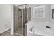 Bright bathroom features a glass shower and separate soaking tub with natural light at 1391 Crane Creek Dr, Mount Pleasant, SC 29466