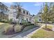 Charming two-story home with a welcoming front porch, lush landscaping, and a well-maintained walkway at 1391 Crane Creek Dr, Mount Pleasant, SC 29466