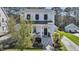 Beautiful two-story white home with a welcoming front porch and well-manicured landscaping, plus detached garage at 1391 Crane Creek Dr, Mount Pleasant, SC 29466
