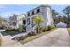Charming two-story home featuring a cozy front porch, well-manicured lawn, and a long private driveway at 1391 Crane Creek Dr, Mount Pleasant, SC 29466