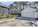 Detached two-car garage with a basketball hoop, adjacent to a fenced yard and a neatly manicured lawn at 1391 Crane Creek Dr, Mount Pleasant, SC 29466