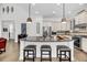 Open kitchen with granite island, pendant lights, stainless appliances and eat-in bar at 1391 Crane Creek Dr, Mount Pleasant, SC 29466