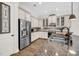 Modern kitchen with stainless steel appliances, custom cabinets, and granite countertops at 1391 Crane Creek Dr, Mount Pleasant, SC 29466