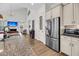 Open kitchen with stainless steel appliances, custom cabinets, and seamless flow to the living area at 1391 Crane Creek Dr, Mount Pleasant, SC 29466