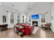 Elegant living room with a fireplace, vaulted ceiling, and an abundance of natural light at 1391 Crane Creek Dr, Mount Pleasant, SC 29466