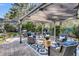 Inviting backyard patio with a covered seating area, fire pit, and stylish outdoor furniture for relaxation at 1391 Crane Creek Dr, Mount Pleasant, SC 29466