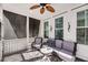 Relaxing screened-in porch with ceiling fan, ample seating, and natural light at 1391 Crane Creek Dr, Mount Pleasant, SC 29466