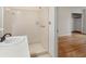 Bathroom with neutral colored tile in shower, white vanity, and walk in shower at 1404 Ivy Isle Dr, Charleston, SC 29412