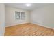 This bedroom features a large window, hardwood floors, neutral walls, and recessed lighting at 1404 Ivy Isle Dr, Charleston, SC 29412