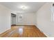 Bright bedroom with wood floors, white walls, and closet with natural light at 1404 Ivy Isle Dr, Charleston, SC 29412