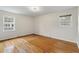 Sun-drenched bedroom showcasing hardwood floors and windows bringing in natural light at 1404 Ivy Isle Dr, Charleston, SC 29412