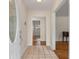 Inviting home foyer featuring tile flooring and views into the living spaces with hardwood floors at 1404 Ivy Isle Dr, Charleston, SC 29412