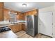 Traditional kitchen featuring wood cabinets, stainless steel appliances, and light countertops at 1404 Ivy Isle Dr, Charleston, SC 29412