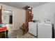 Laundry area with a washer, dryer, and a staircase leading to another level at 1404 Ivy Isle Dr, Charleston, SC 29412