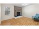 Living room featuring a classic brick fireplace, hardwood floors, and a cozy ambiance at 1404 Ivy Isle Dr, Charleston, SC 29412