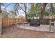 Relaxing patio with outdoor seating, a stone fire pit, and wooden fencing providing a perfect space for entertaining at 1404 Ivy Isle Dr, Charleston, SC 29412