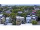 This aerial showcases the house nestled among lush trees in a vibrant neighborhood, near the city at 15 Corinne St # B, Charleston, SC 29403